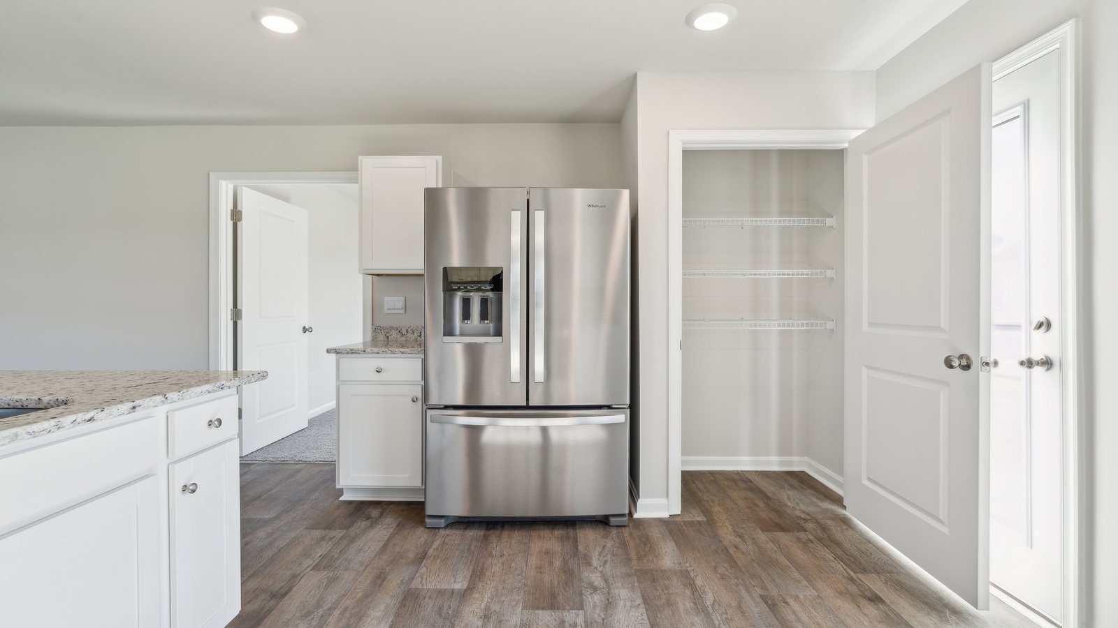 The well-equipped kitchen has a corner pantry.