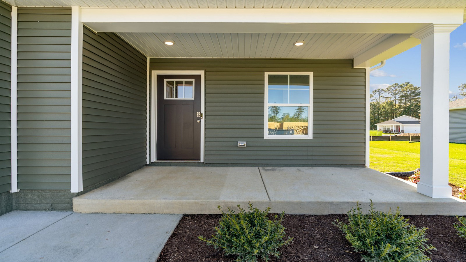A welcoming front porch leads you into the home.