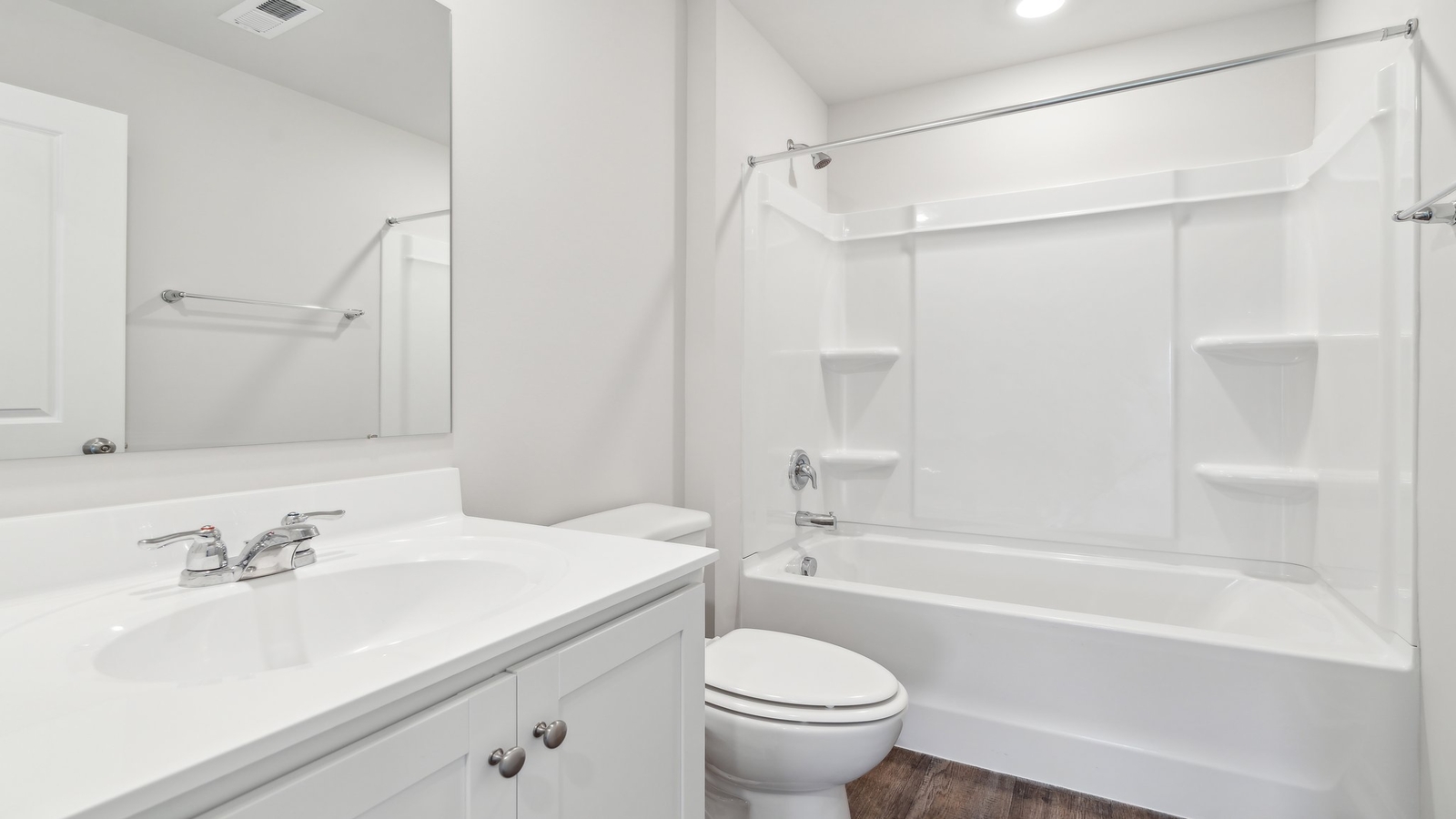 Another bathroom is located in the front of the home.