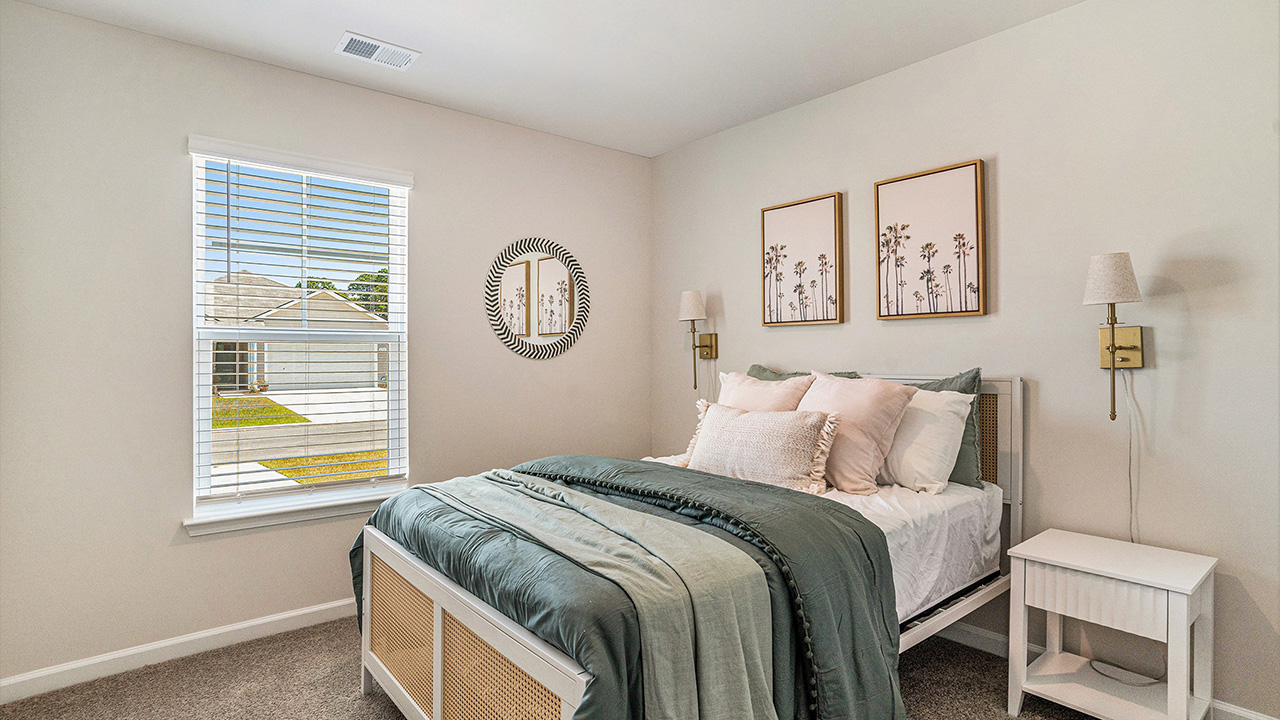 The two guest bedrooms and guest bathroom are separate from the living areas of the home.