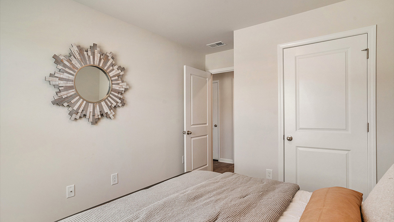 The two guest bedrooms and guest bathroom are separate from the living areas of the home.
