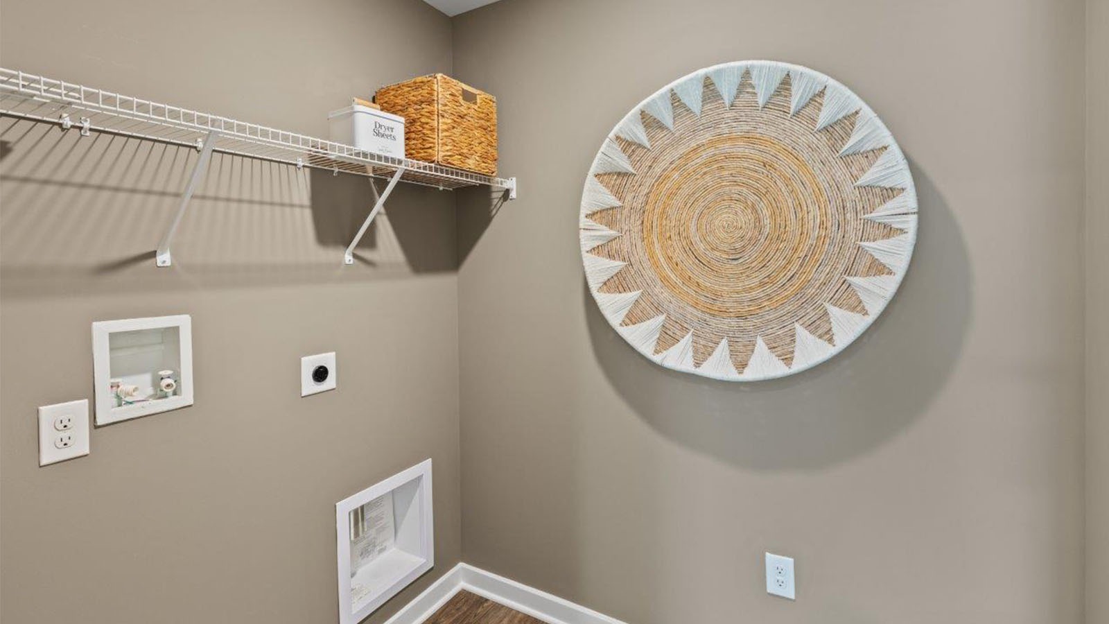 The laundry room is centrally located upstairs along with a hall linen closet.