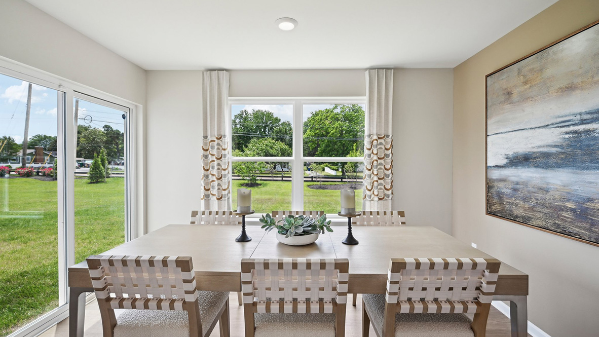 The kitchen has a designated dining area with a sliding glass door for easy access to the backyard.