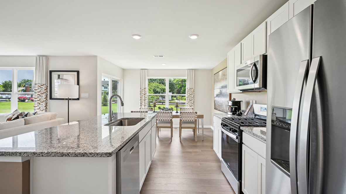 The spacious kitchen has an impressive corner pantry and stainless steel appliances.