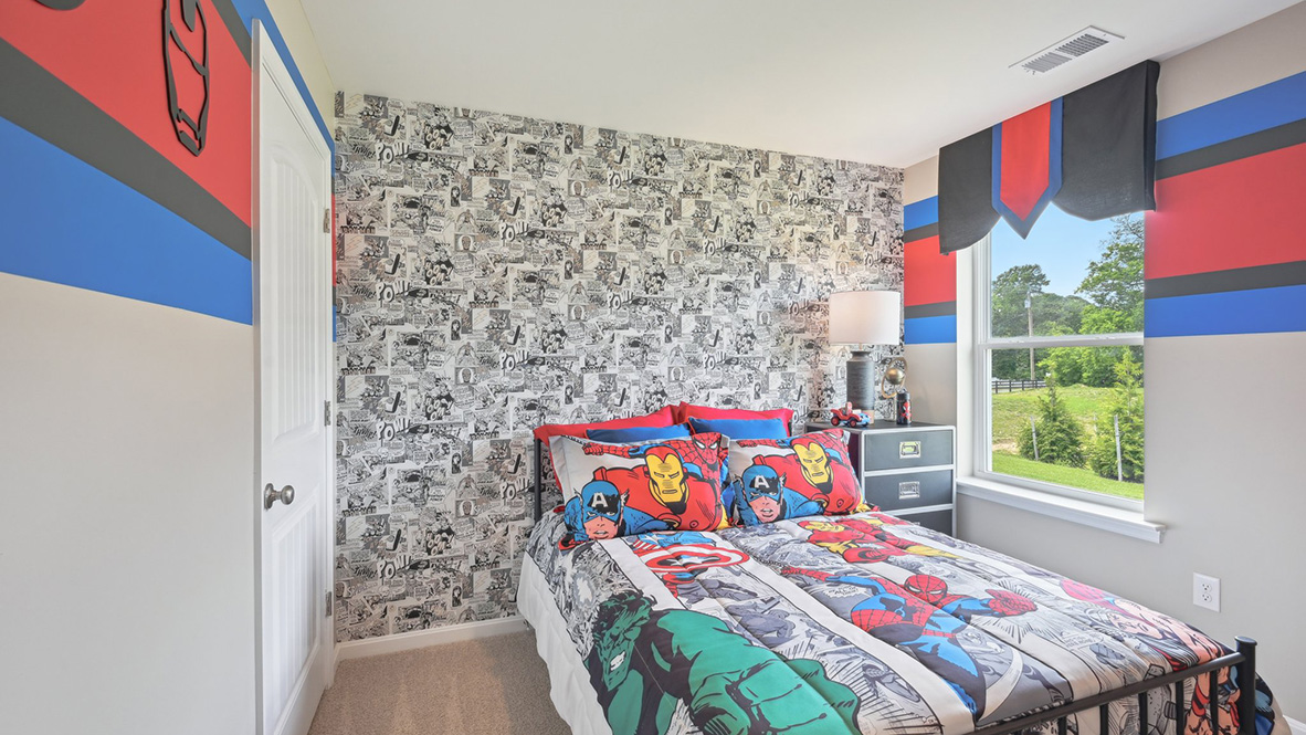 Another guest bedroom has a window in the corner.