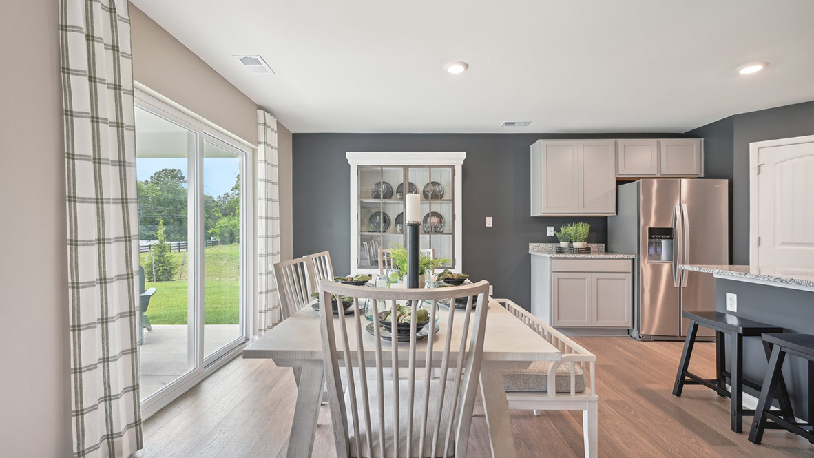 The dining area looks out to the back yard.