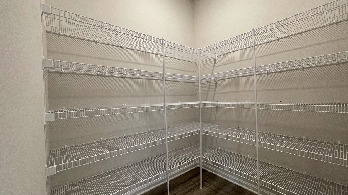 The spacious kitchen boasts an expansive walk-in pantry.