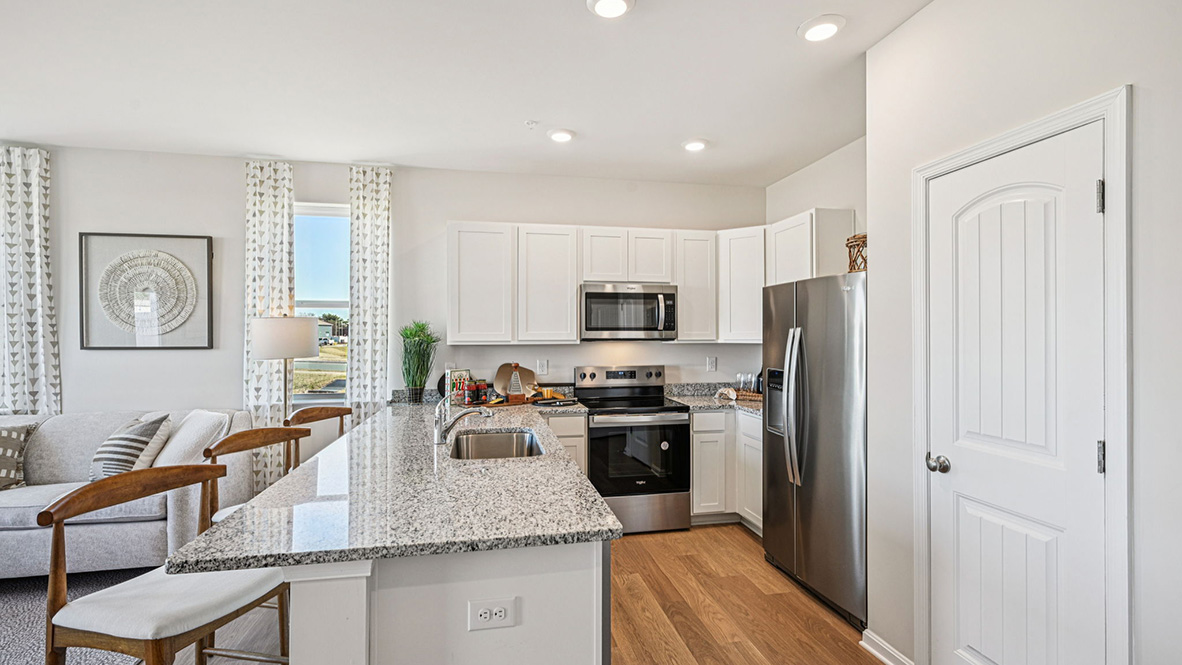 The home's functional eat-in kitchen features stainless steel appliances.