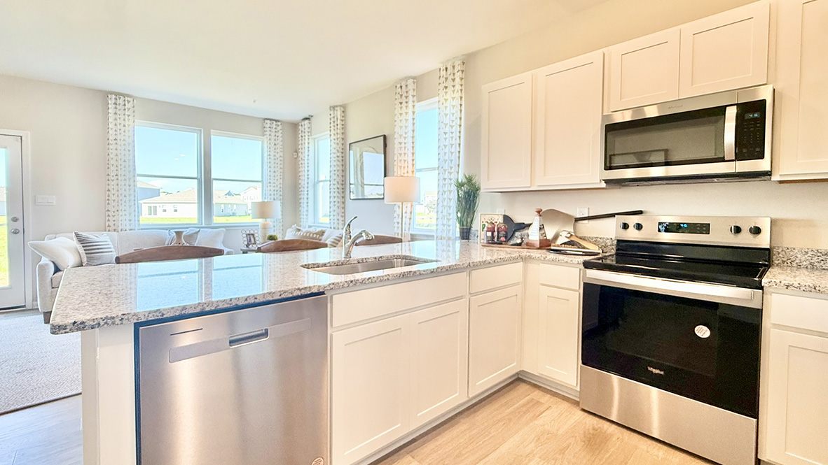 The home's functional eat-in kitchen features stainless steel appliances.