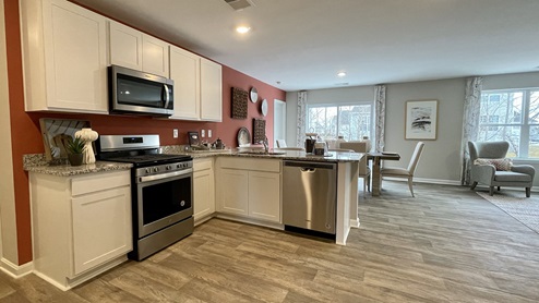 The kitchen overlooks the spacious great room allowing plenty of space for family and friends to gather.