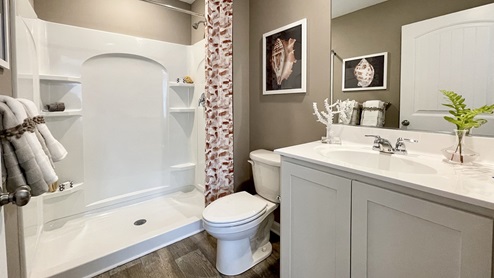 The owner’s suite features an en suite bath.
