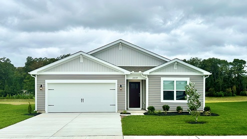 A Cali ranch home with yellow siding.