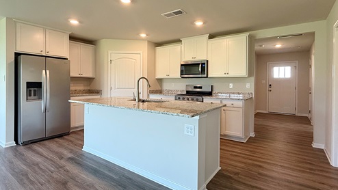 There is a large center island in the kitchen.