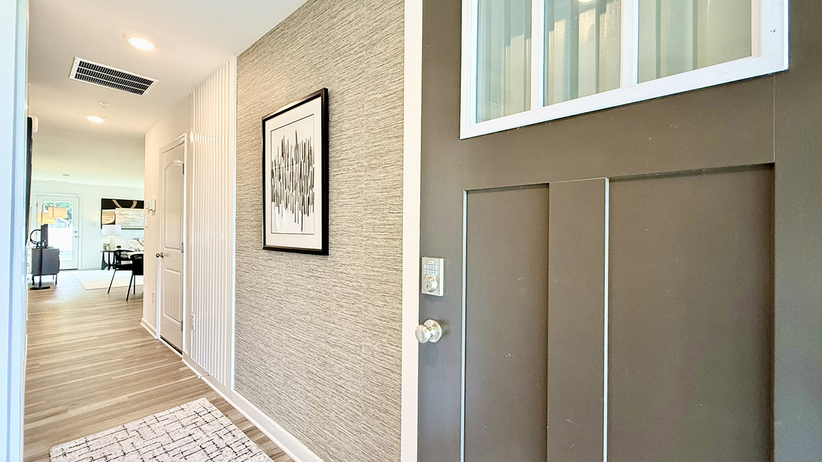 As you enter this home a bright, long hallway greets you.