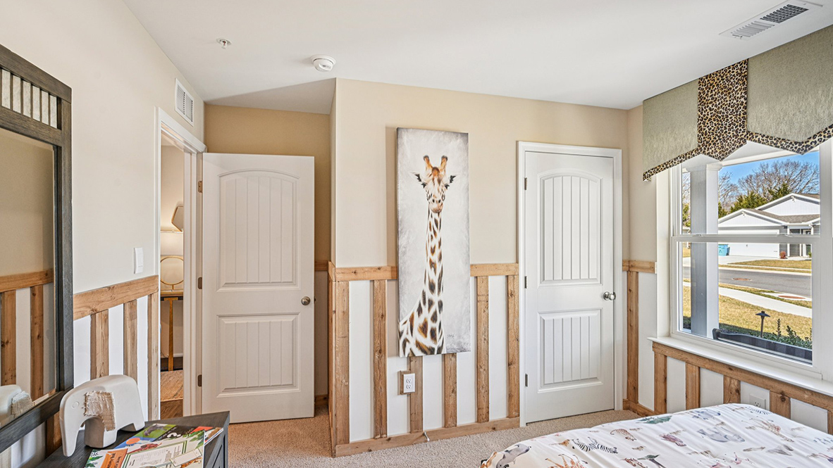 The guest bedroom has a corner closet.
