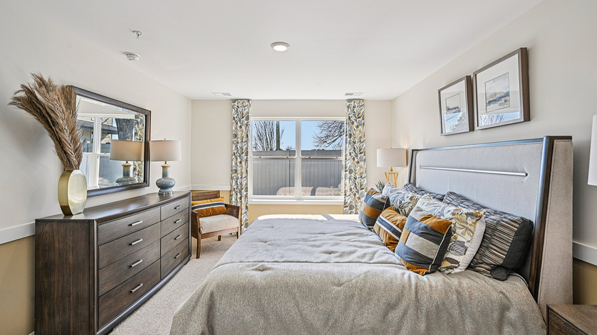The primary bedroom has a large double window.