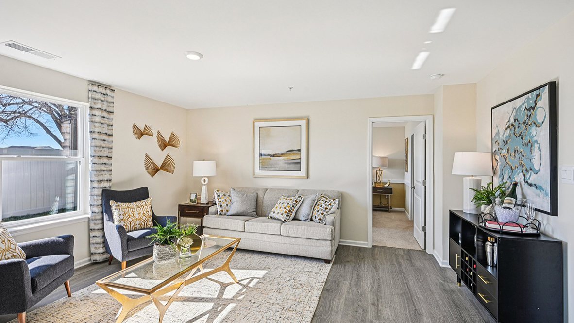 The open-concept floorplan connects the living, dining and kitchen.