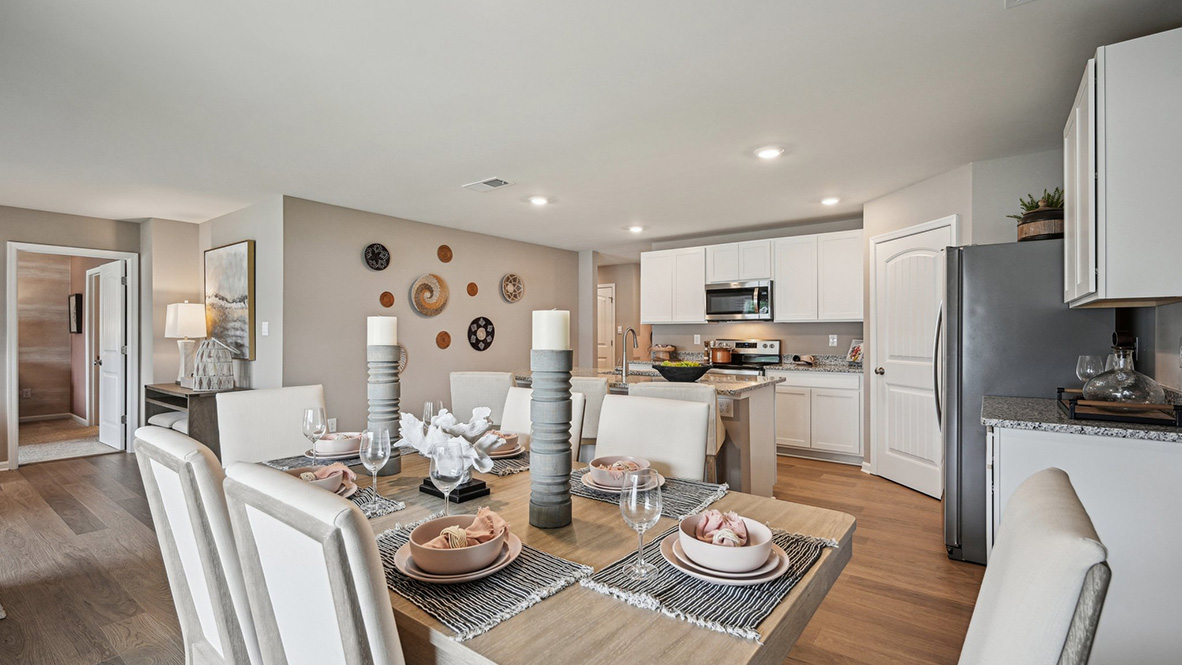 The kitchen is open to the informal dining area.