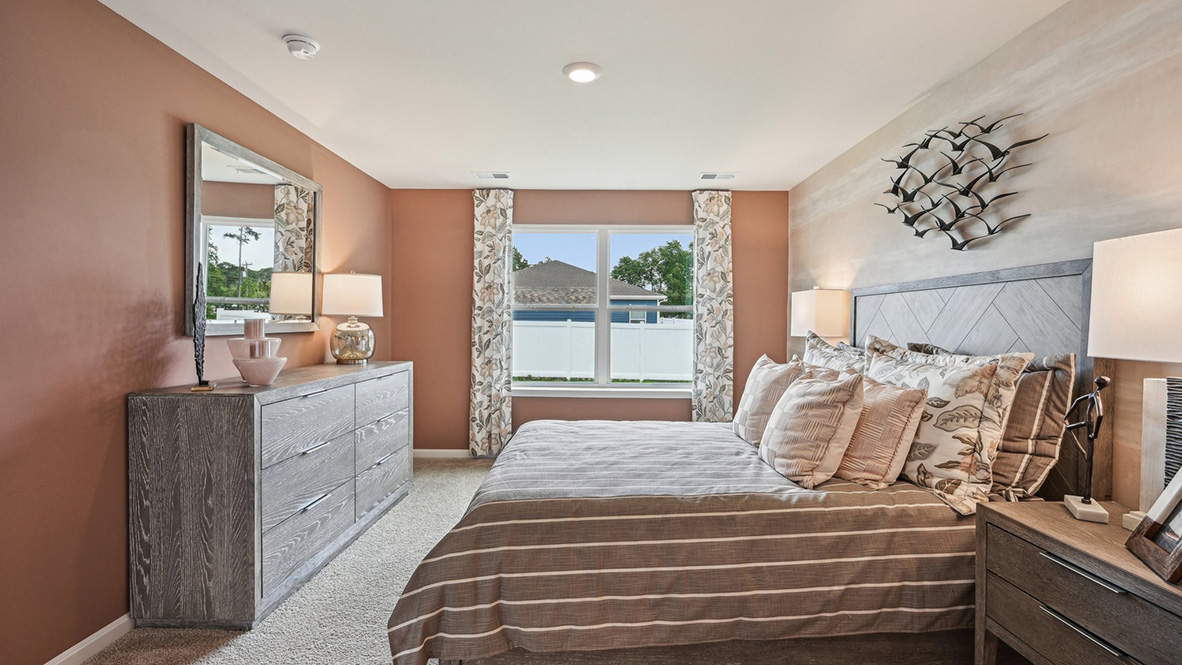 The primary bedroom has a large double window.