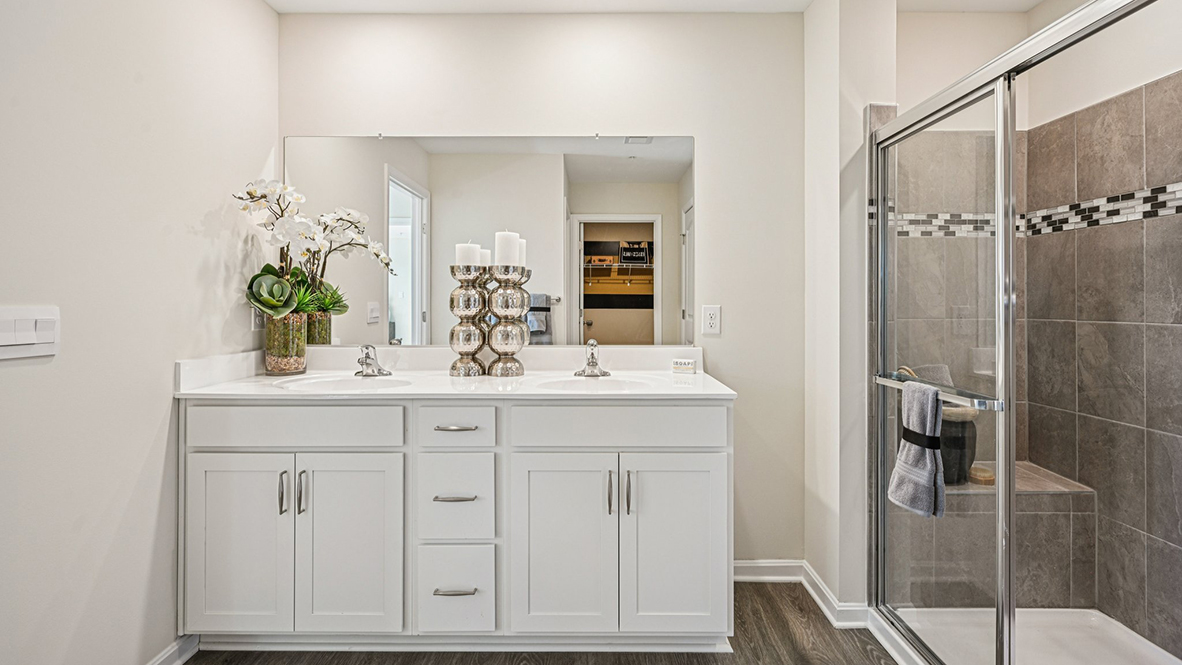The primary bathroom has a double-bowl vanity.