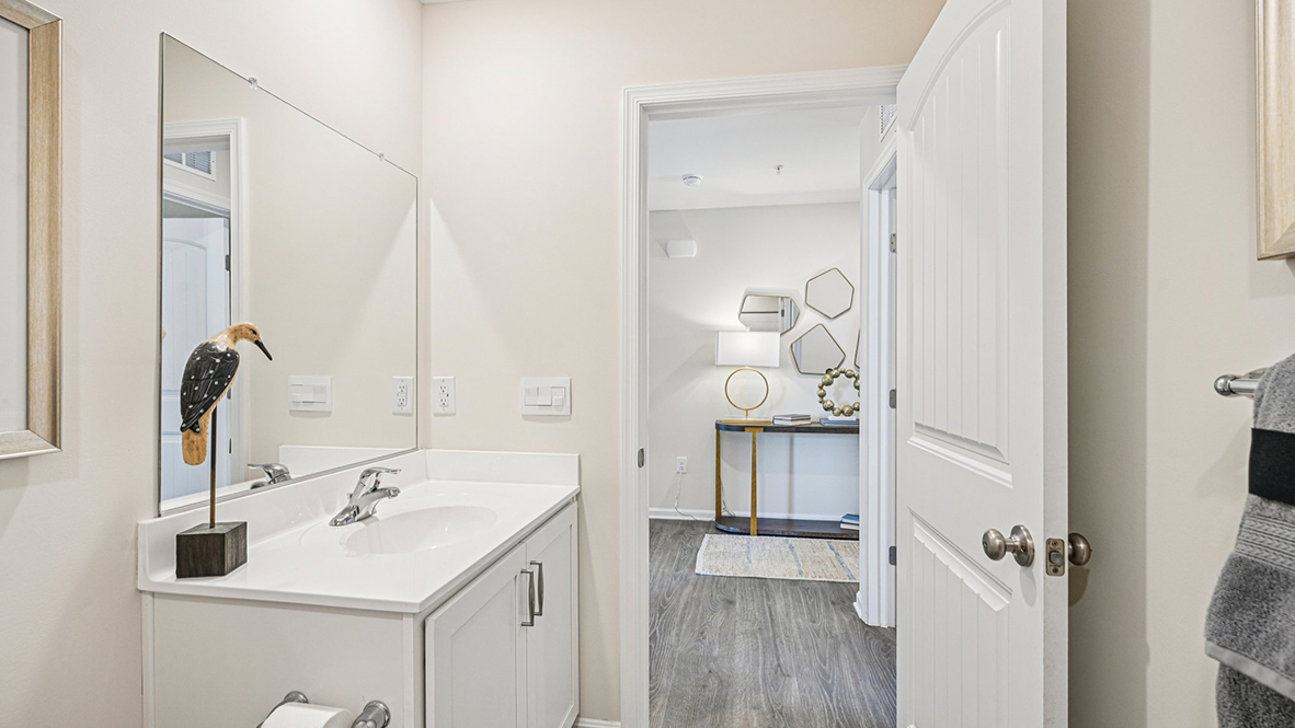 Two guest bedrooms share the same bath.