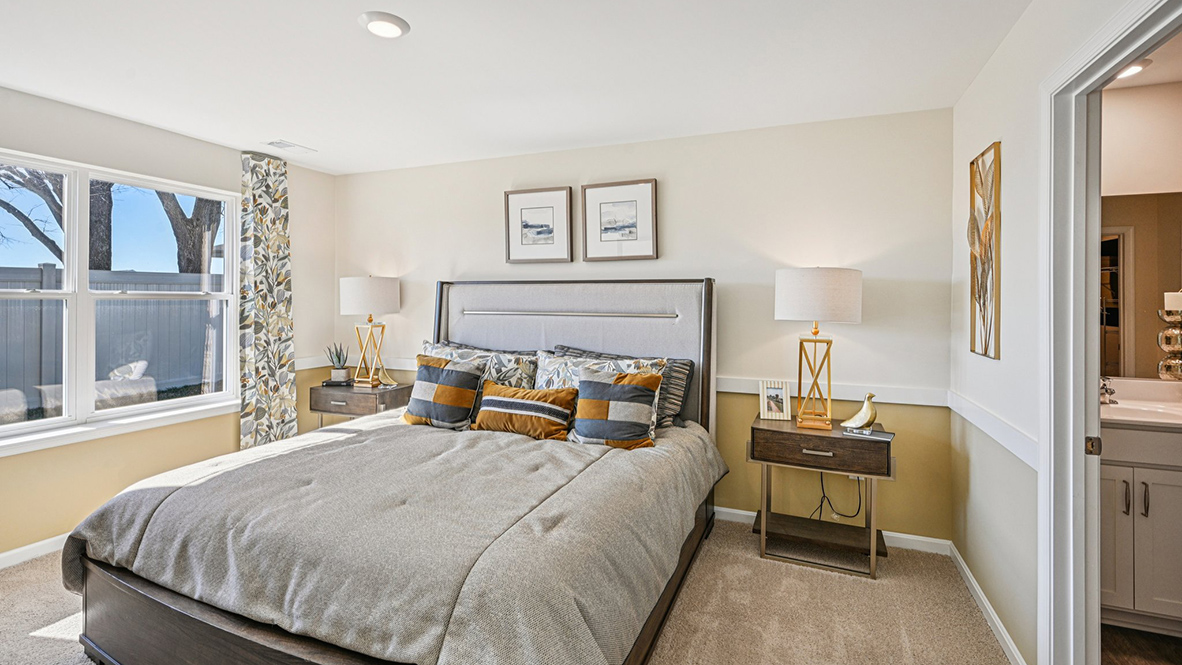 The primary bedroom has a large double window.