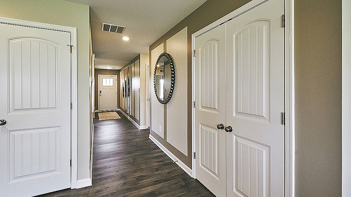 The welcoming foyer leads to a spacious hallway.
