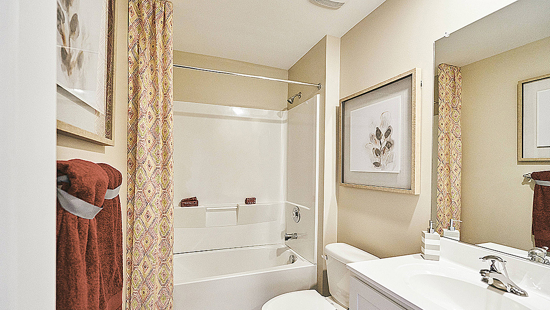 Two secondary roomy bedrooms are located off the foyer and share a full bathroom.