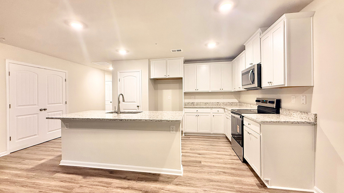 The functional kitchen offers plenty of cabinet space.