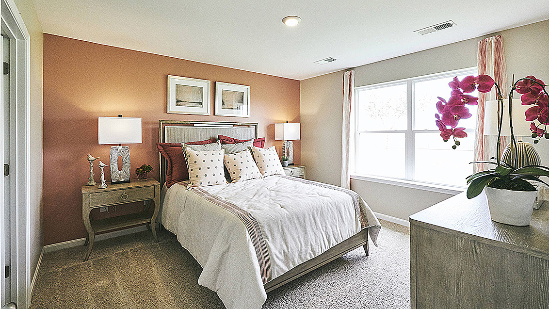 The owner's suite is privately tucked away from the great room and features a walk-in closet and a private, full bathroom.