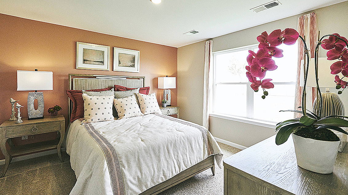 The owner's suite is privately tucked away from the great room and features a walk-in closet and a private, full bathroom.