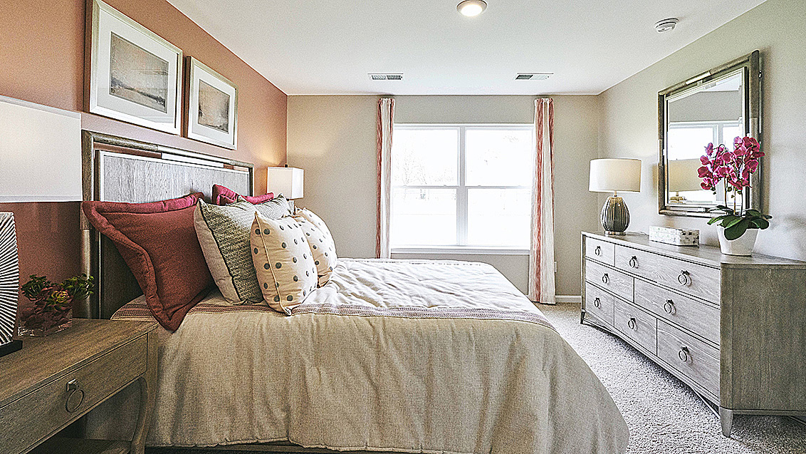 The owner's suite is privately tucked away from the great room and features a walk-in closet and a private, full bathroom.