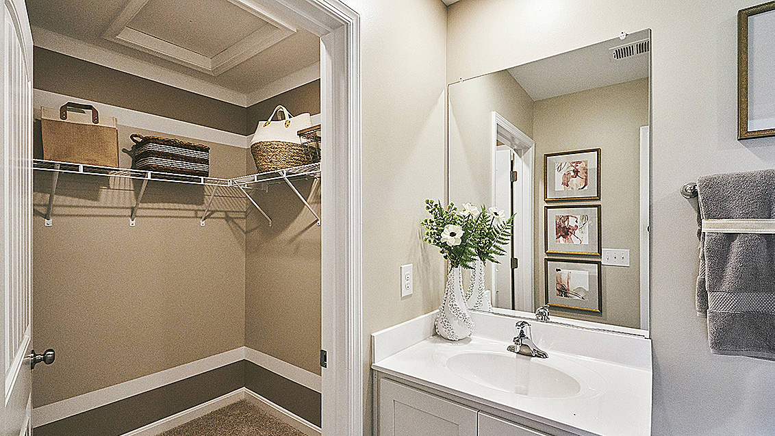 The owner's suite is privately tucked away from the great room and features a walk-in closet and a private, full bathroom.