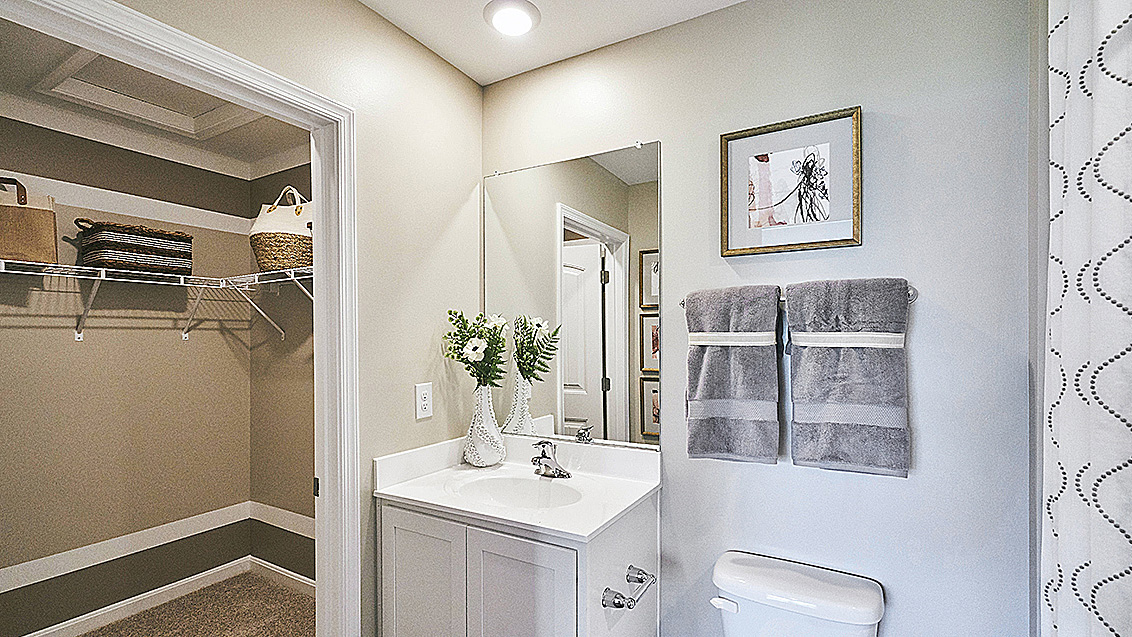 The owner's suite is privately tucked away from the great room and features a walk-in closet and a private, full bathroom.