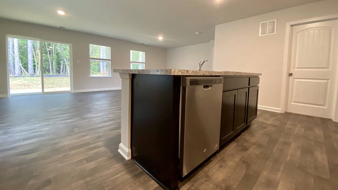 The kitchen is open to the ample great room and dining area.