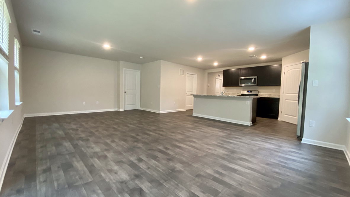Lismore open floor plan from kitchen leading to living area.
