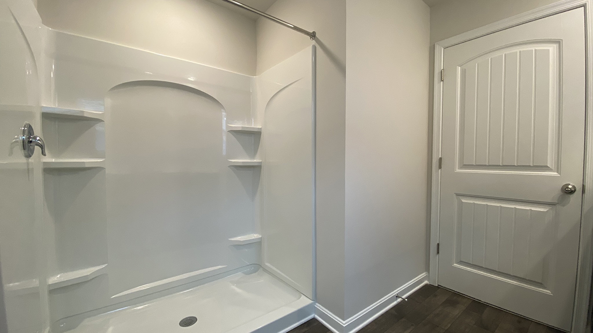 There is a private bathroom in the owner's suite with a walk-in shower.