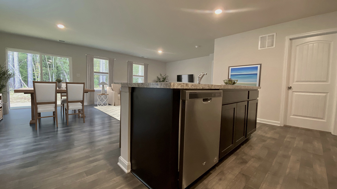 The kitchen is open to the ample great room and dining area.