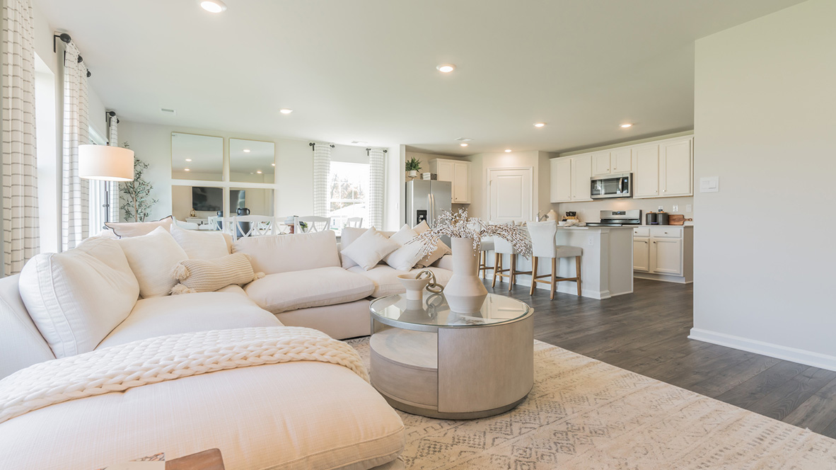 The ample great room and dining area both offer an abundance of natural light.