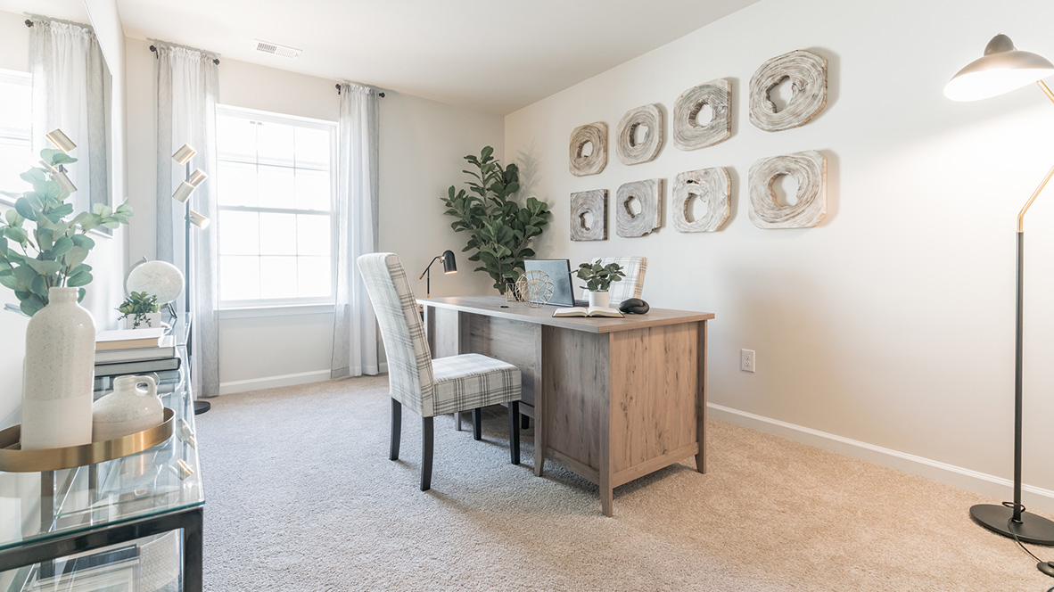 A spacious guest bedroom with a closet is in the front of the home.
