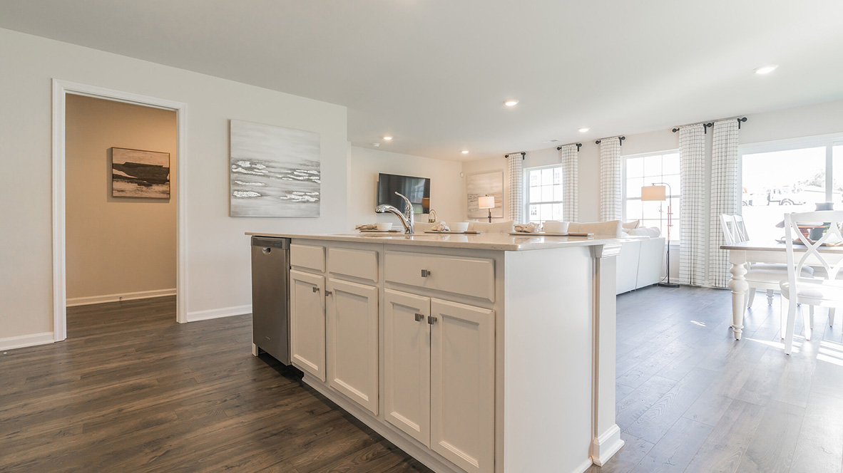 The kitchen is open to the ample great room and dining area.