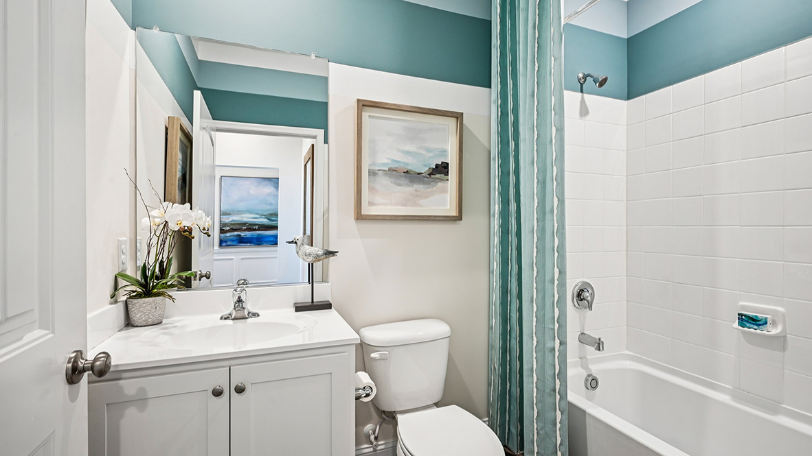 The guest bathroom is across the hall from guest bedroom.