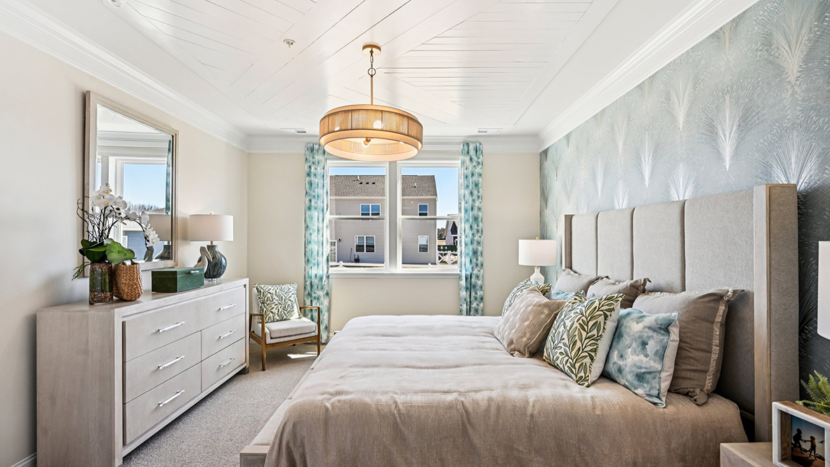 The large primary bedroom is a retreat in the back of the home.