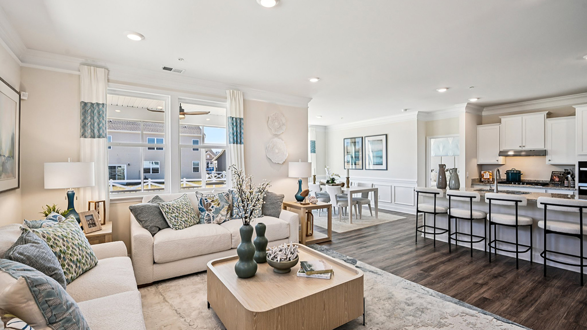 The living area opens into the kitchen and dining rooms.