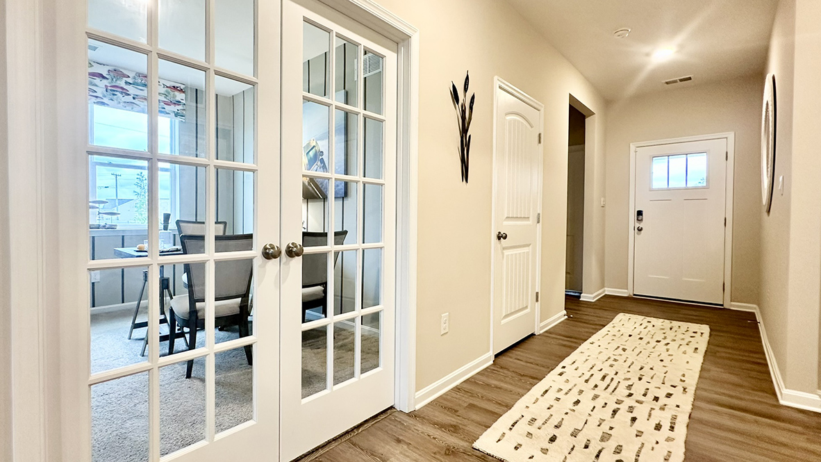Stylish French doors open into the flex room.