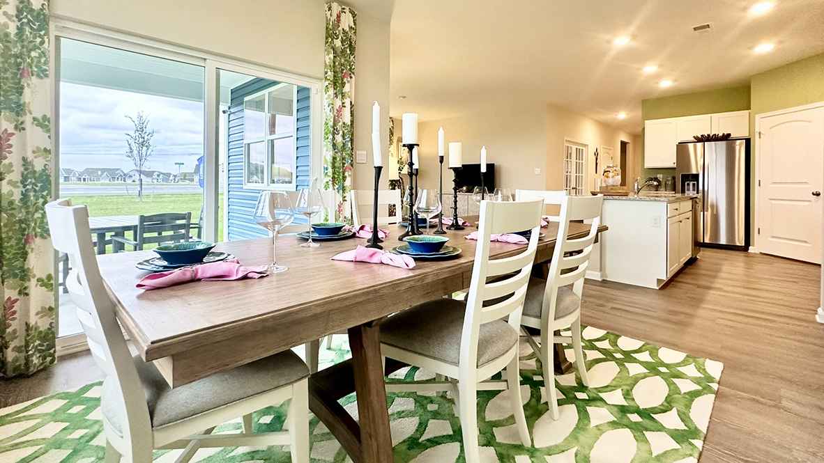 The dining area leads to the rear-covered patio.