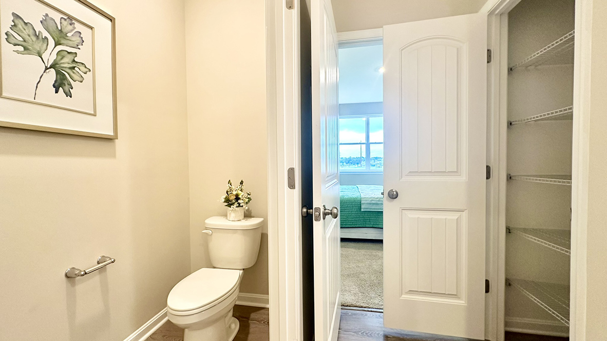 The large primary bedroom has a private bathroom with large linen closet.