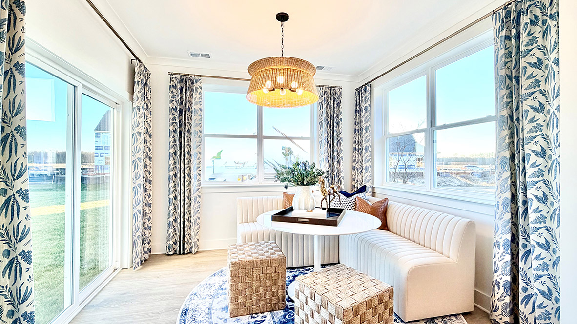The Granary model sunroom with large windows and a sliding glass door.