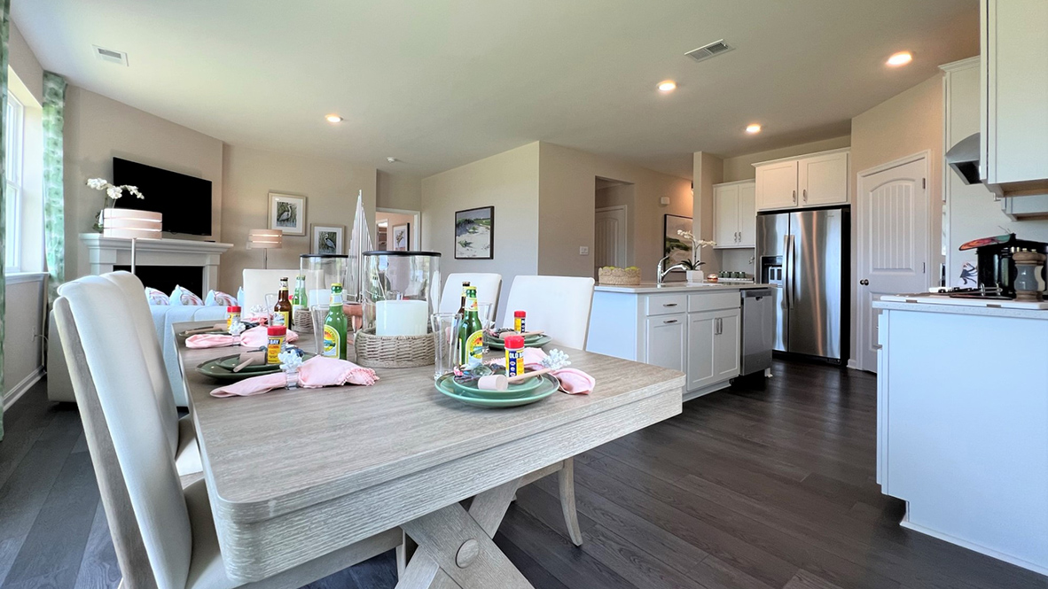 The kitchen includes stainless steel appliances.