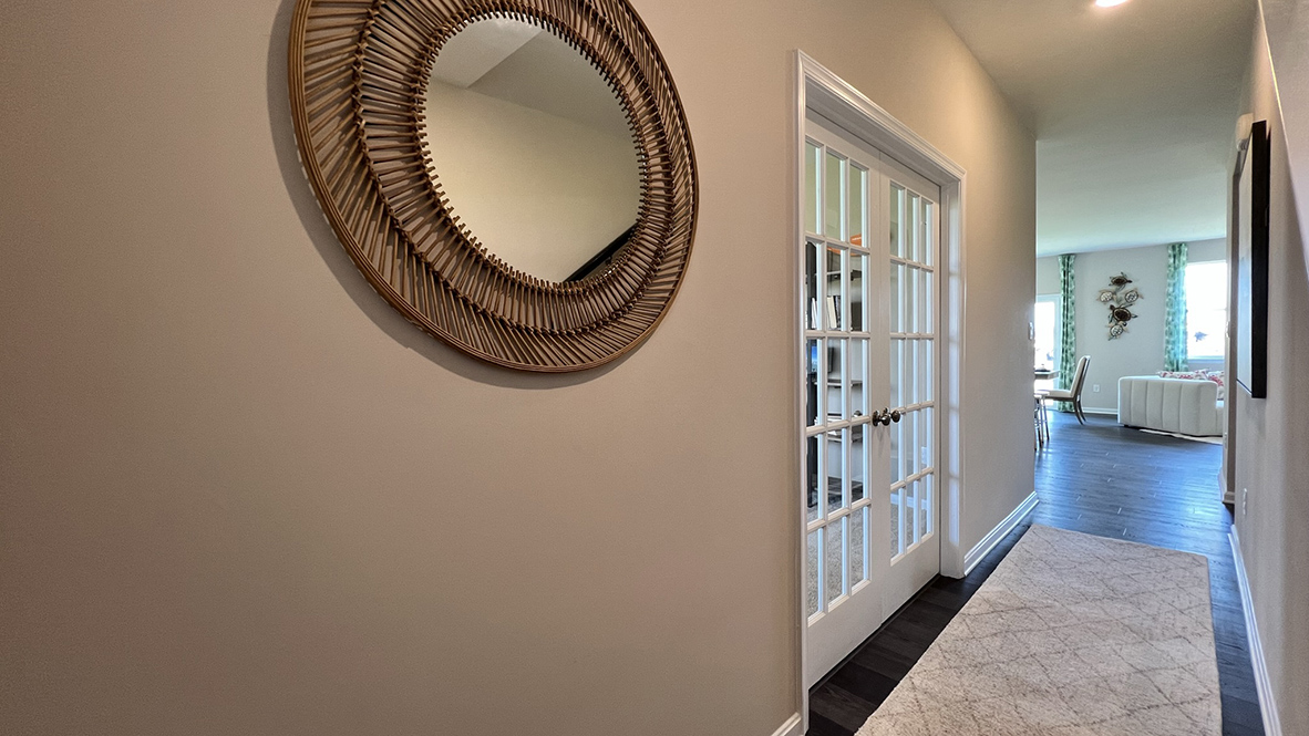 As you enter the home the foyer leads you past the flex room.